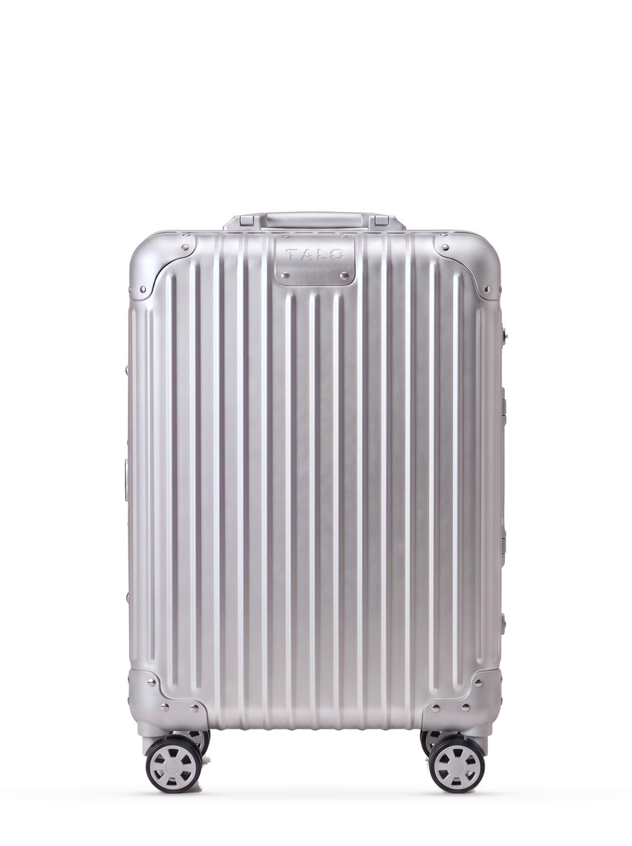TALO The Cabin aluminum carry-on, front view, ribbed silver shell with the engraved TALO nameplate.