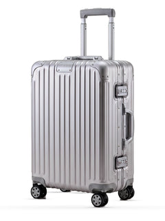TALO The Cabin aluminum carry-on at a three-quarter angle with the telescoping handle extended.