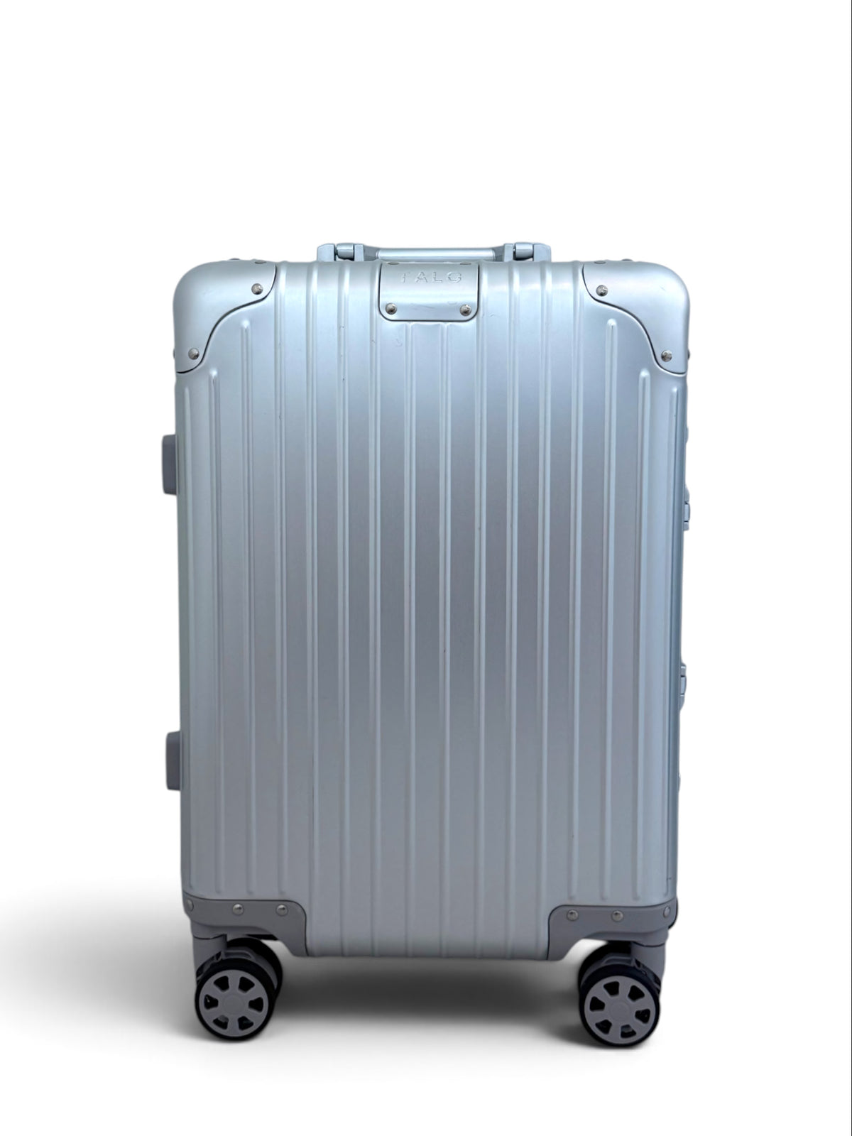 Talo 20-inch silver aluminum carry-on suitcase with a ribbed shell, TSA frame latches, and silent spinner wheels.